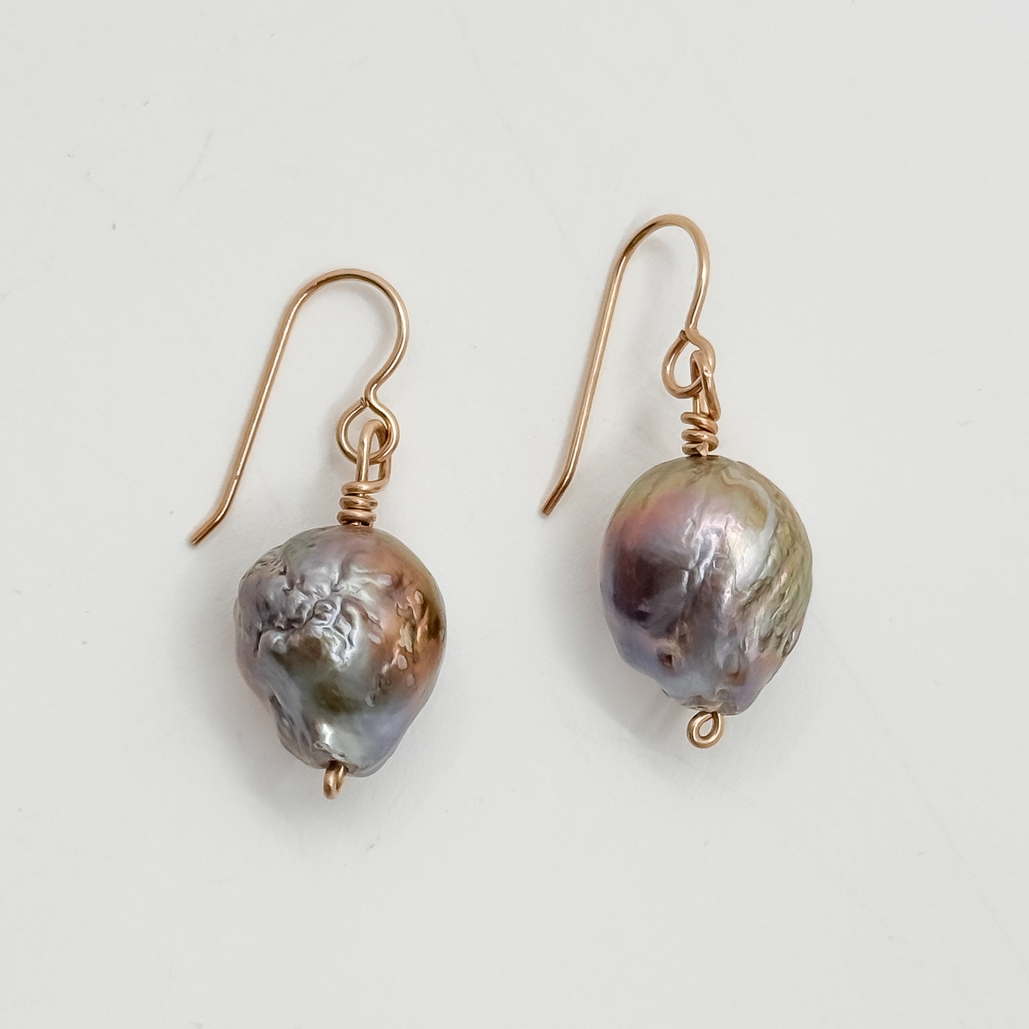 Single large Peacock Baroque pearl earrings