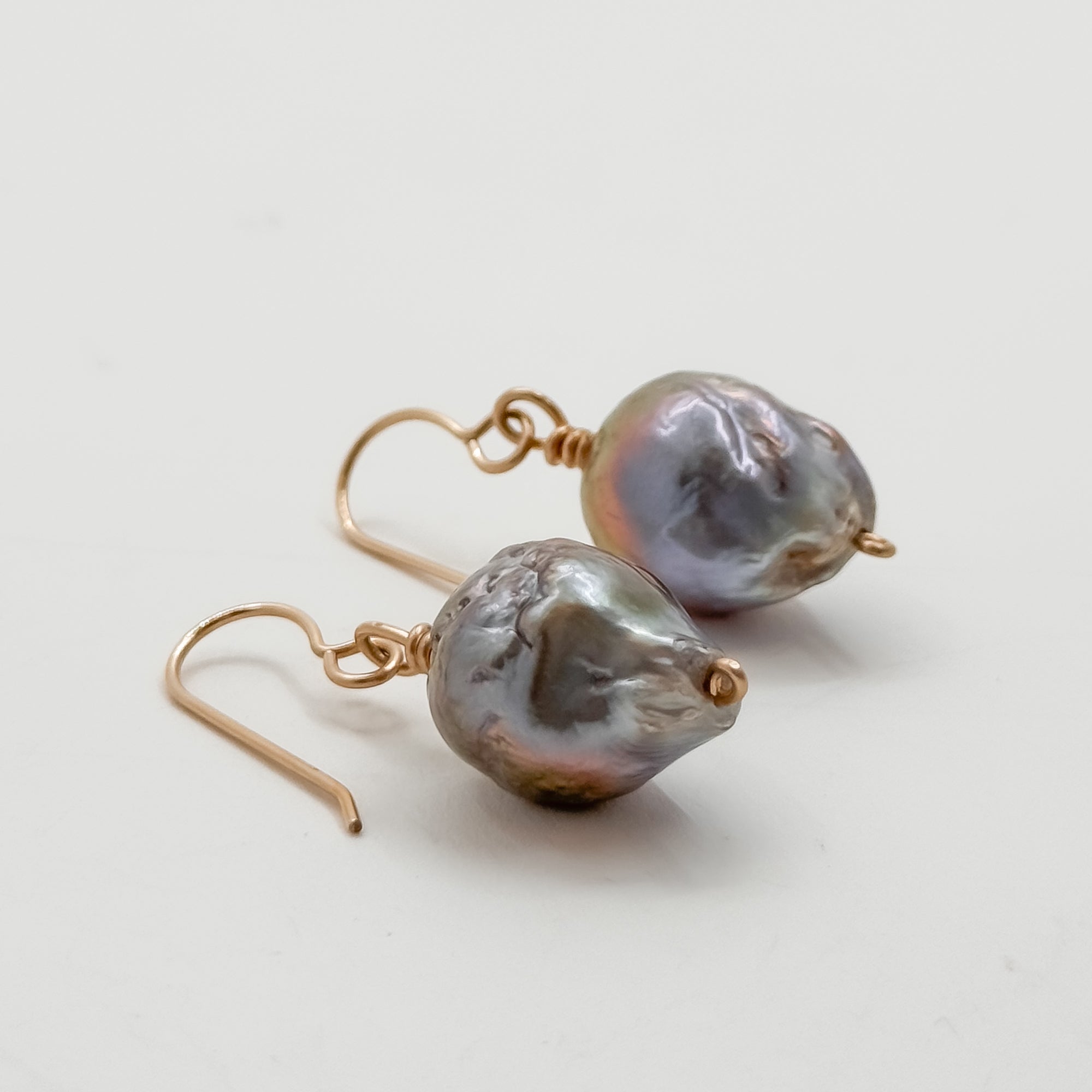 Single large Peacock Baroque pearl earrings