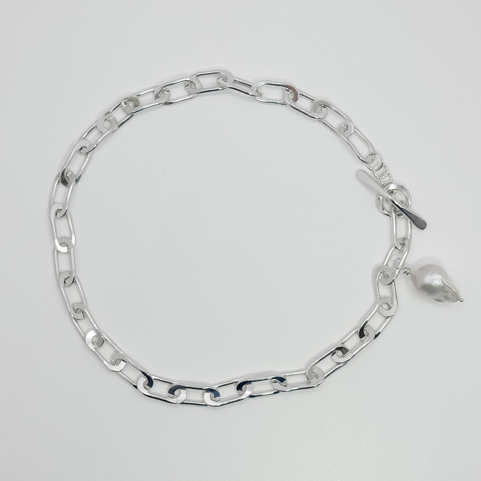 Tow Truck Jr with baroque pearl necklace