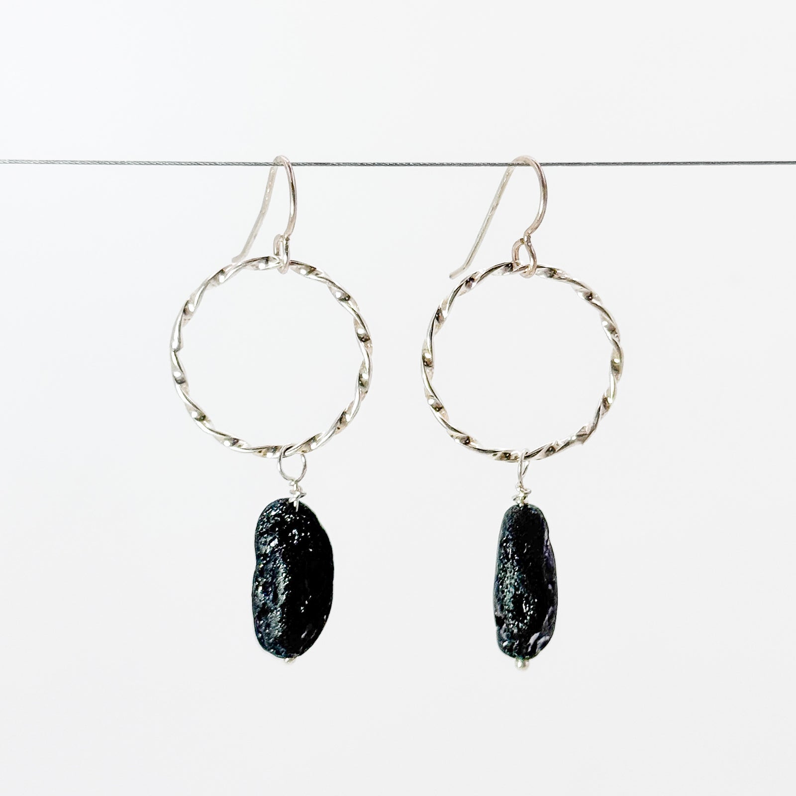 Twisted circle drop earrings with black tourmaline
