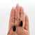 Twisted circle drop earrings with black tourmaline