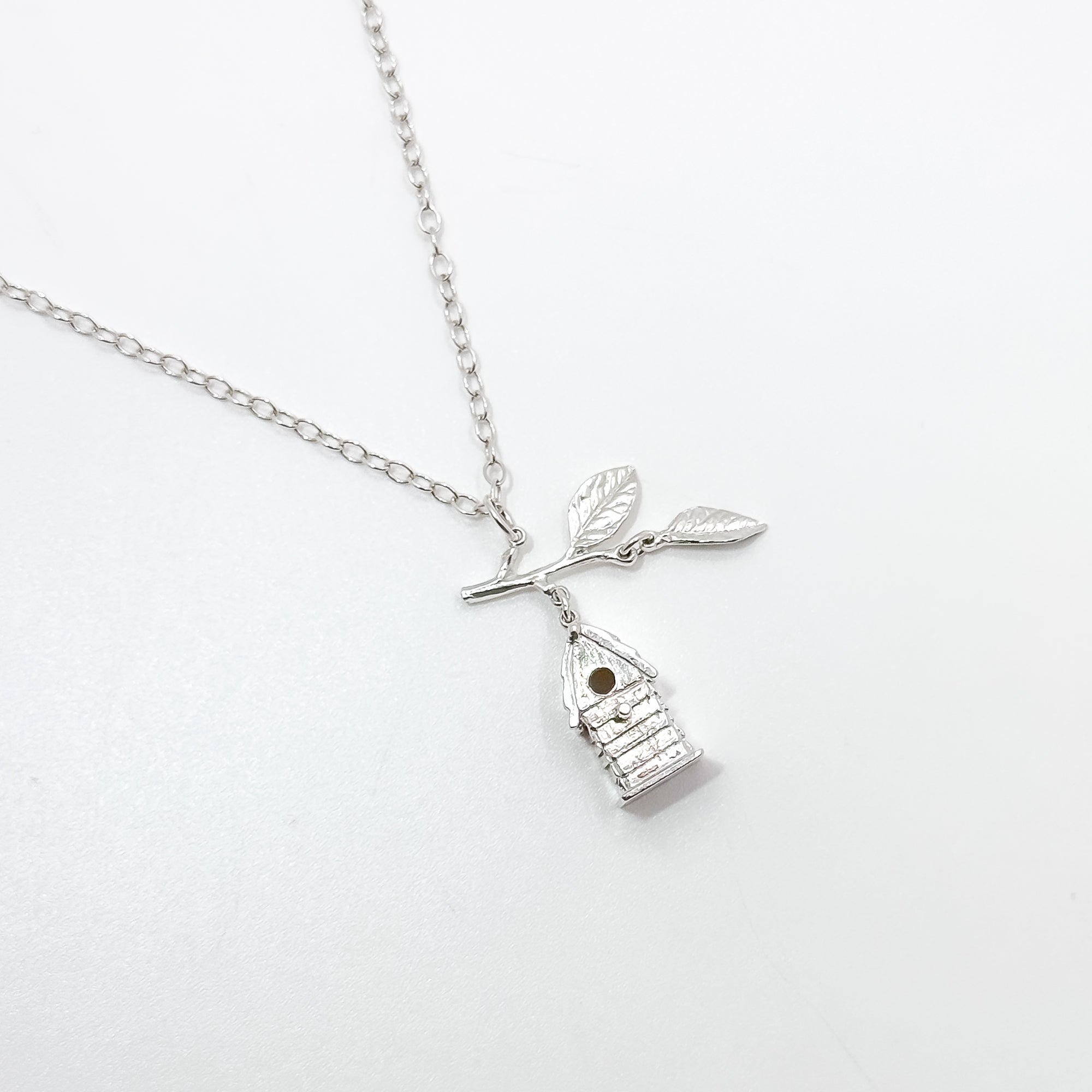 Birdhouse pendant with branch