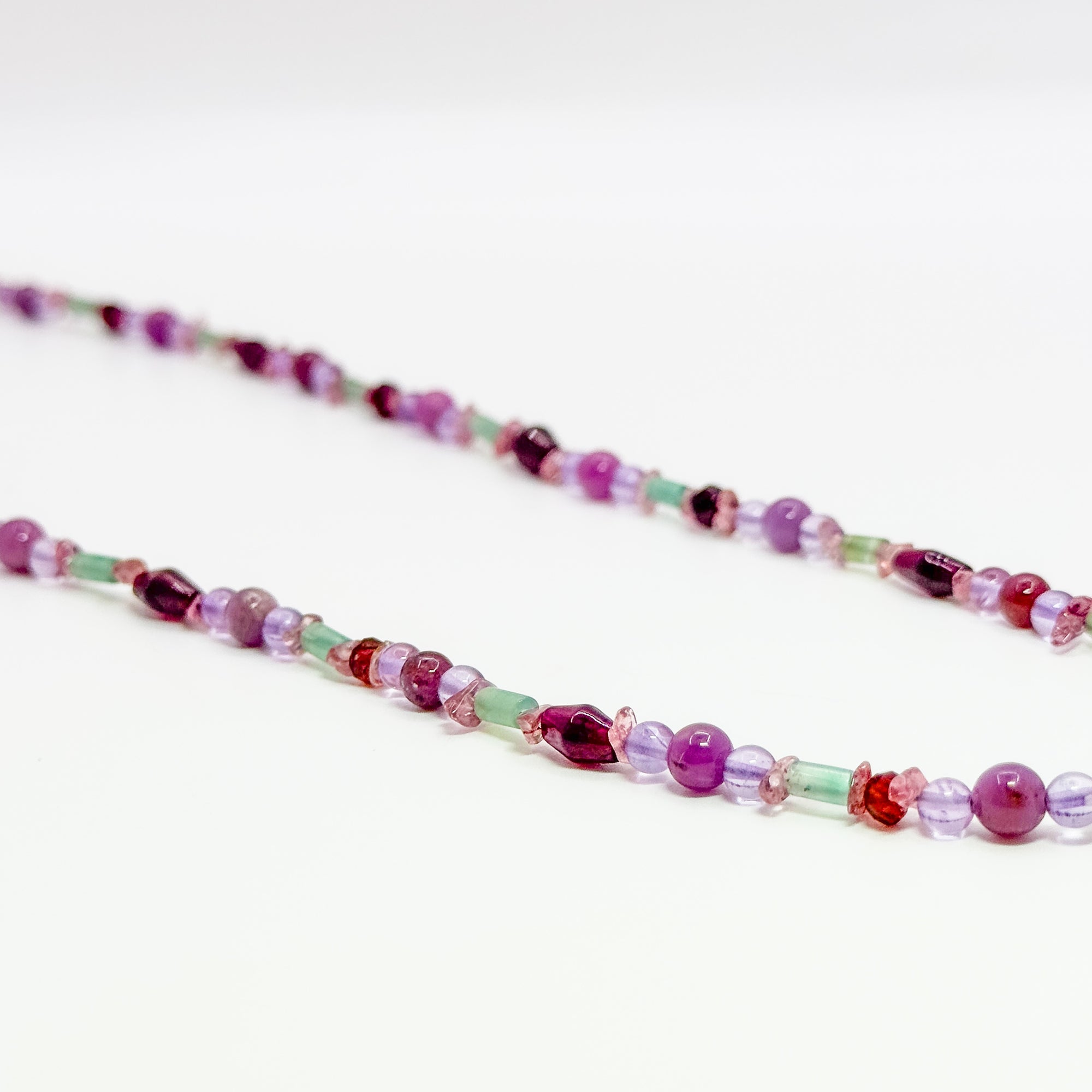 Amethyst, garnet and aqua accented beaded necklace