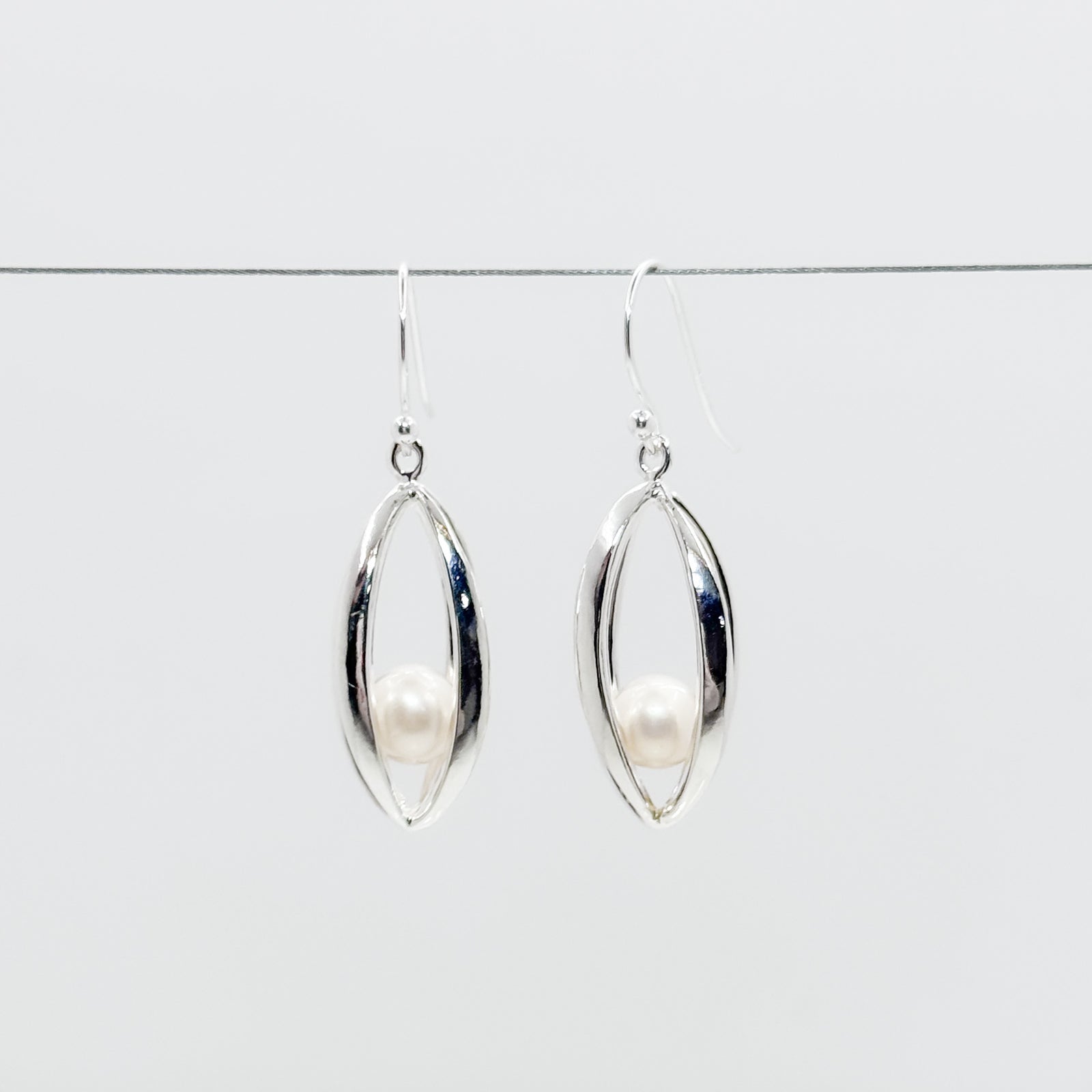 Big Cage Earrings with White trapped Freshwater Pearl