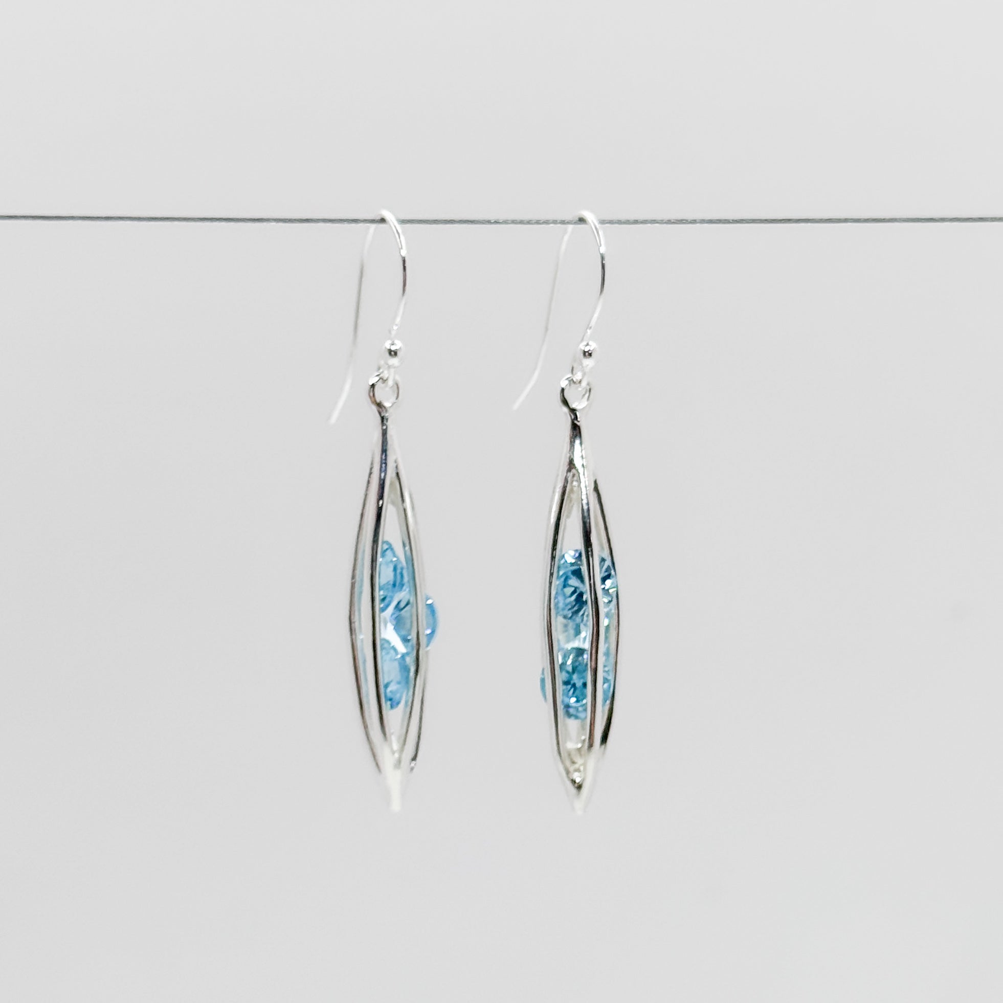 Small Caged Earrings with trapped Aqua CZ