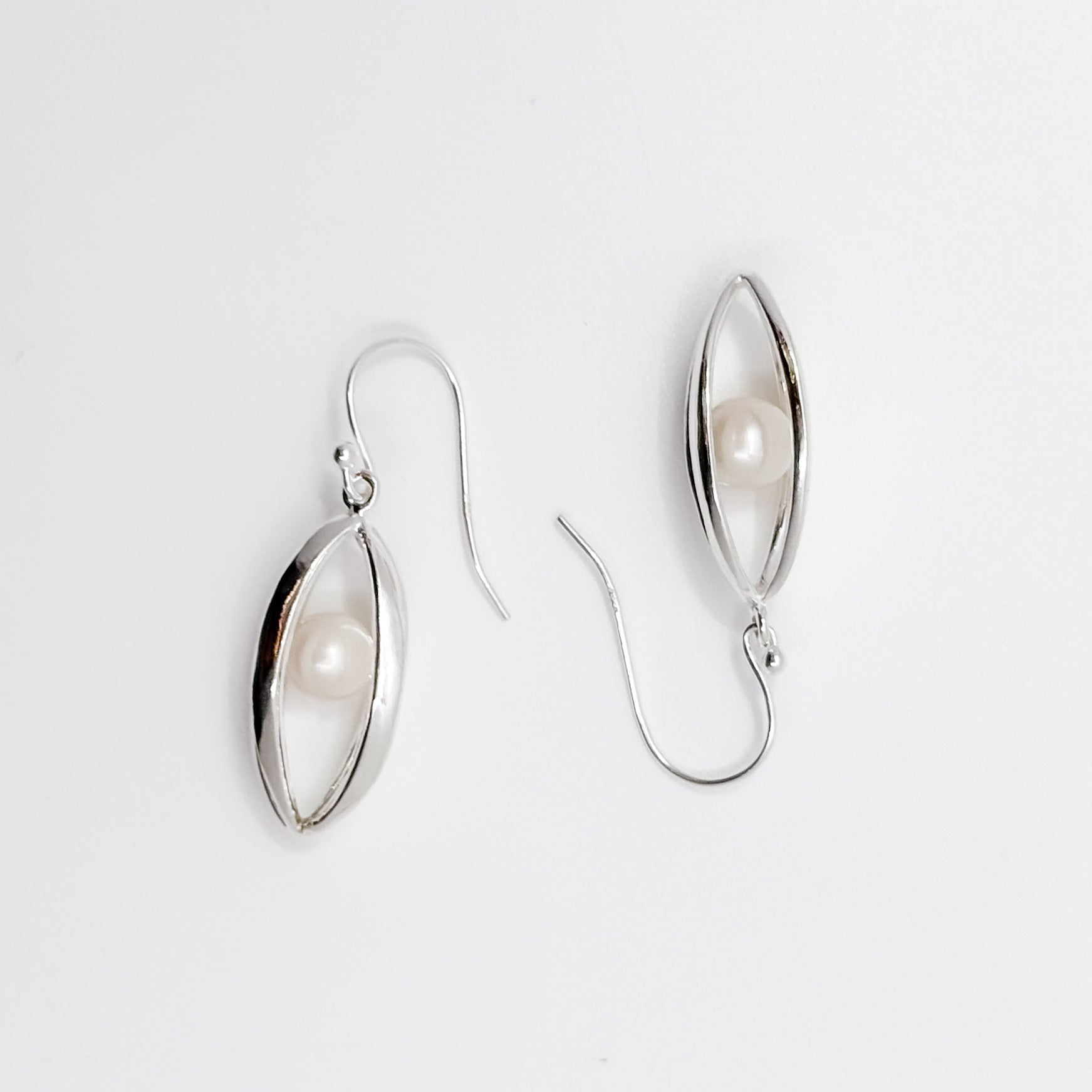 Big Cage Earrings with White trapped Freshwater Pearl