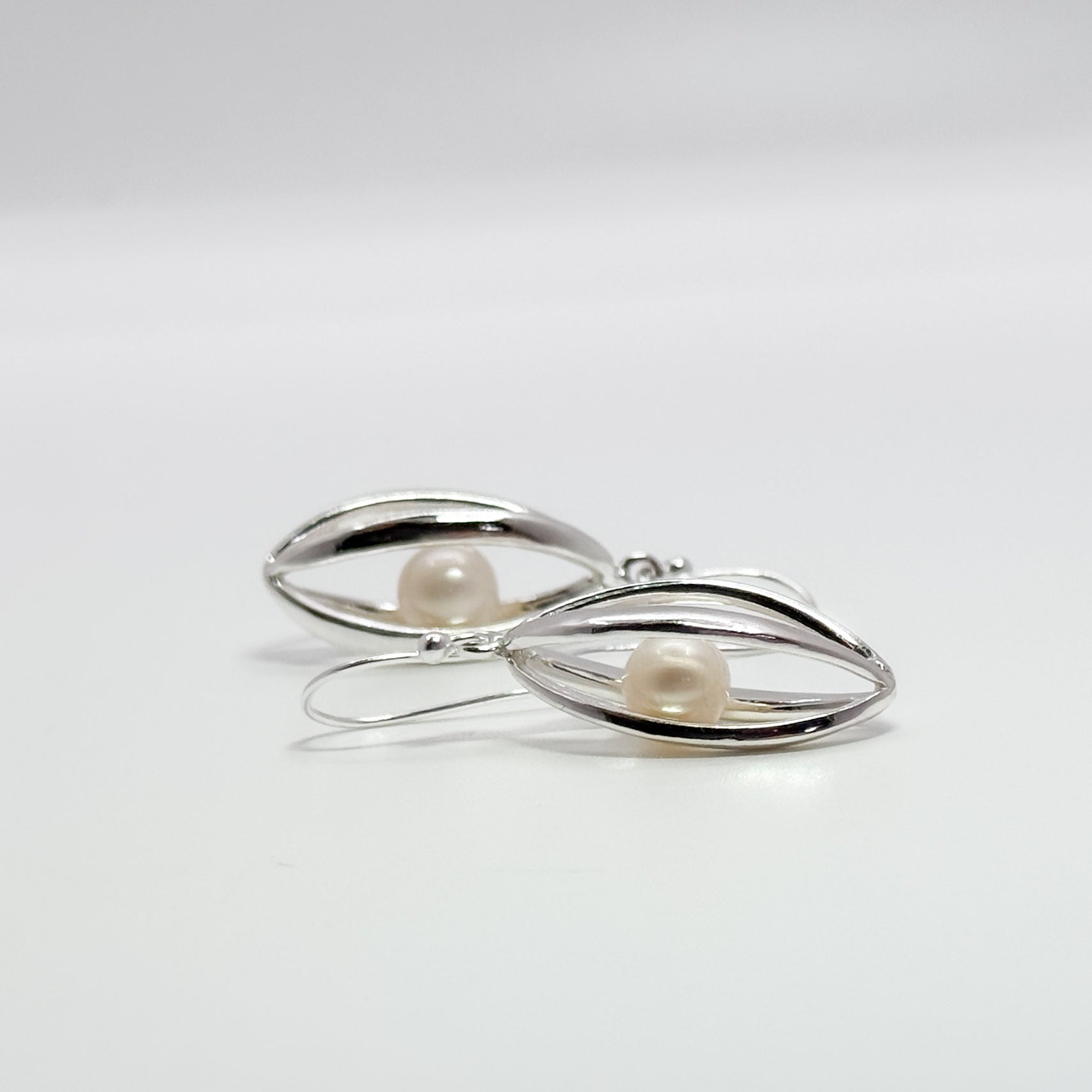 Big Cage Earrings with White trapped Freshwater Pearl