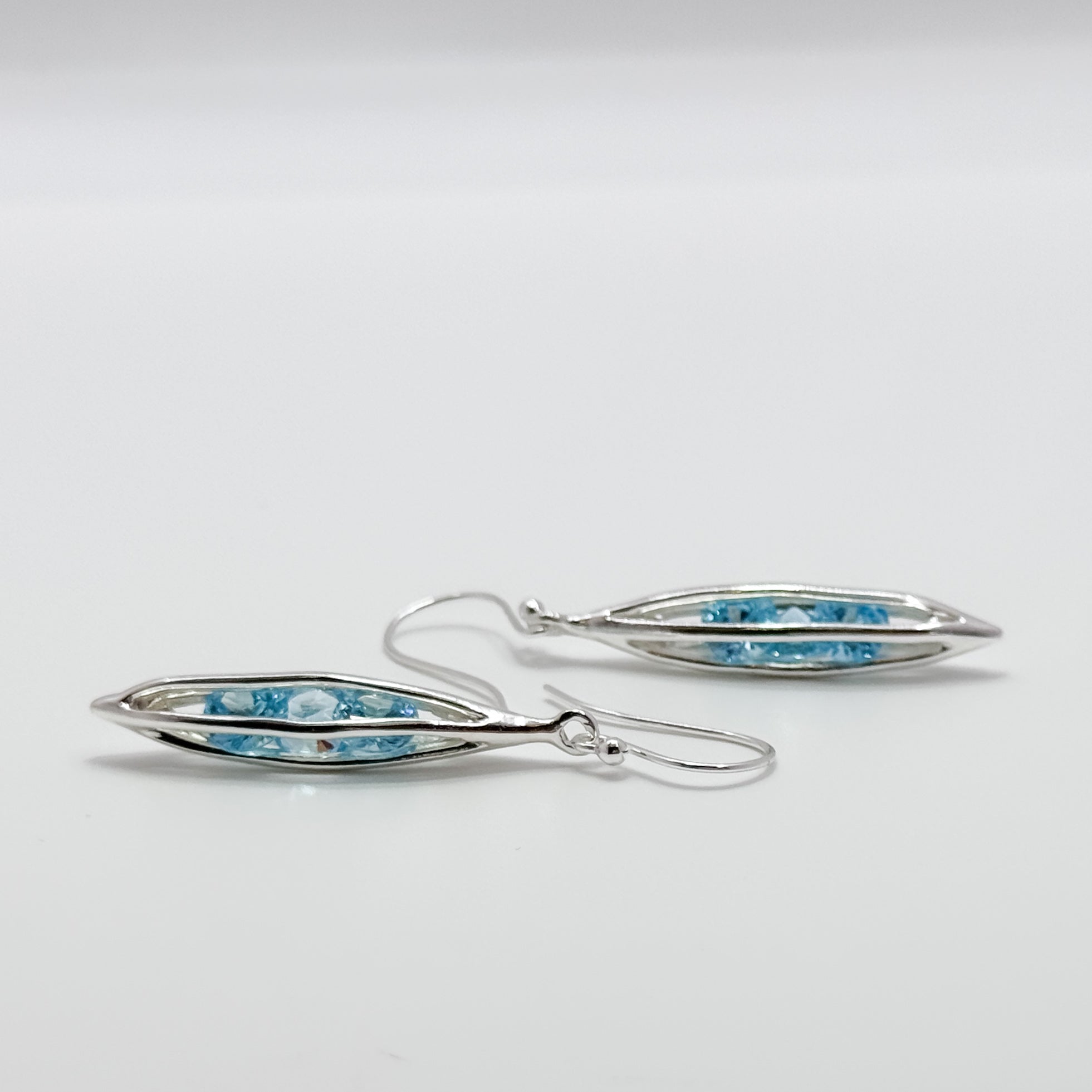 Small Caged Earrings with trapped Aqua CZ