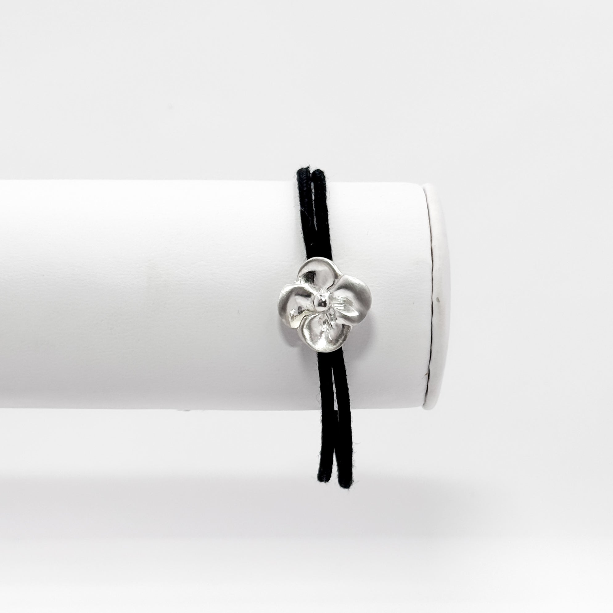 Small Pansy bracelet on black brushed cotton cord