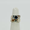 overlap ring with faceted blue topaz