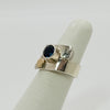 overlap ring with faceted blue topaz