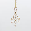 Twizzle Neck with pearl necklace