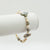 Sweet Susan single strand bracelet with gold tone beads and mixed white/bronze pearls