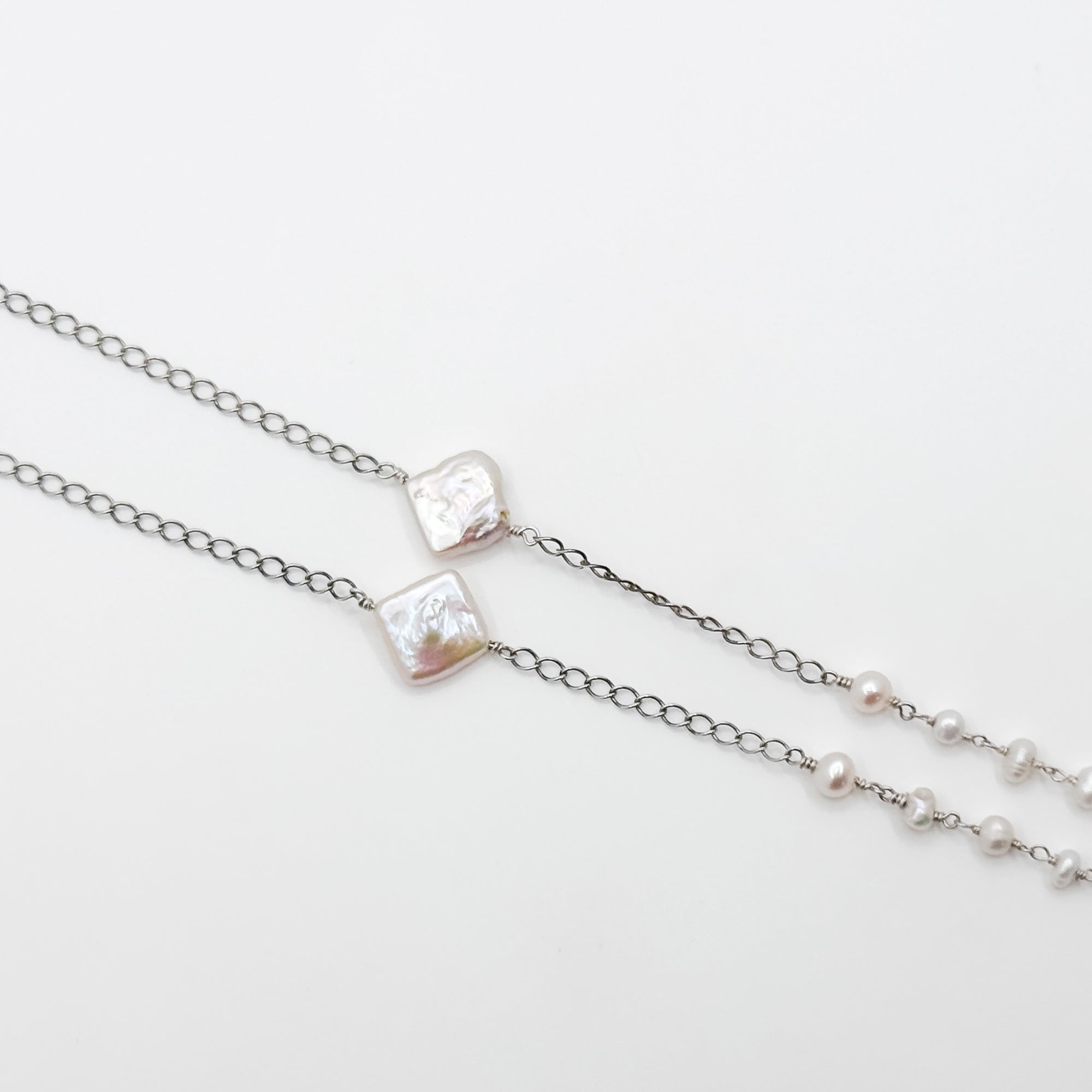 Enamel copper heart pendant on pearl chain necklace