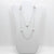 No Yolk with white pearls necklace