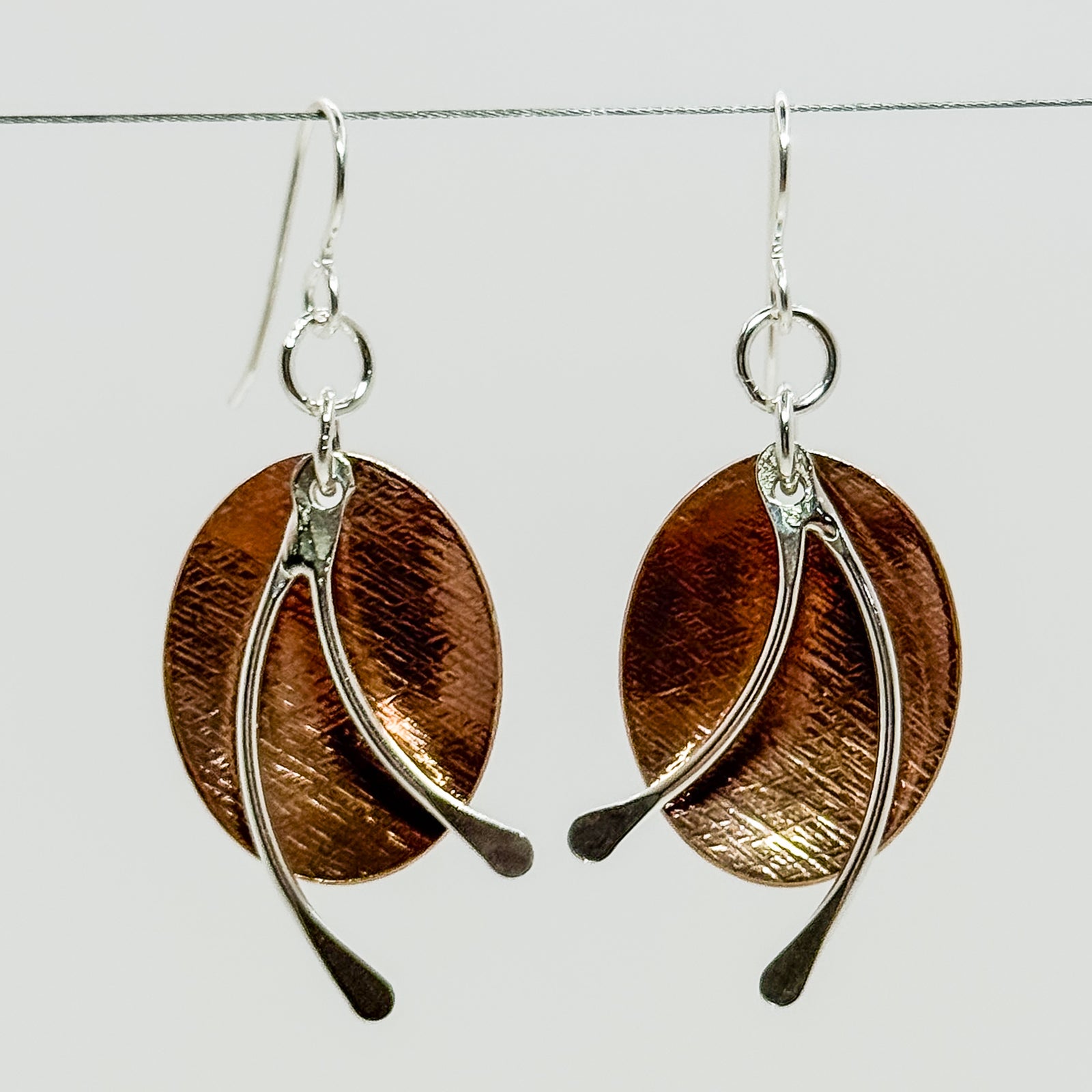 Copper ovals with silver short dangles