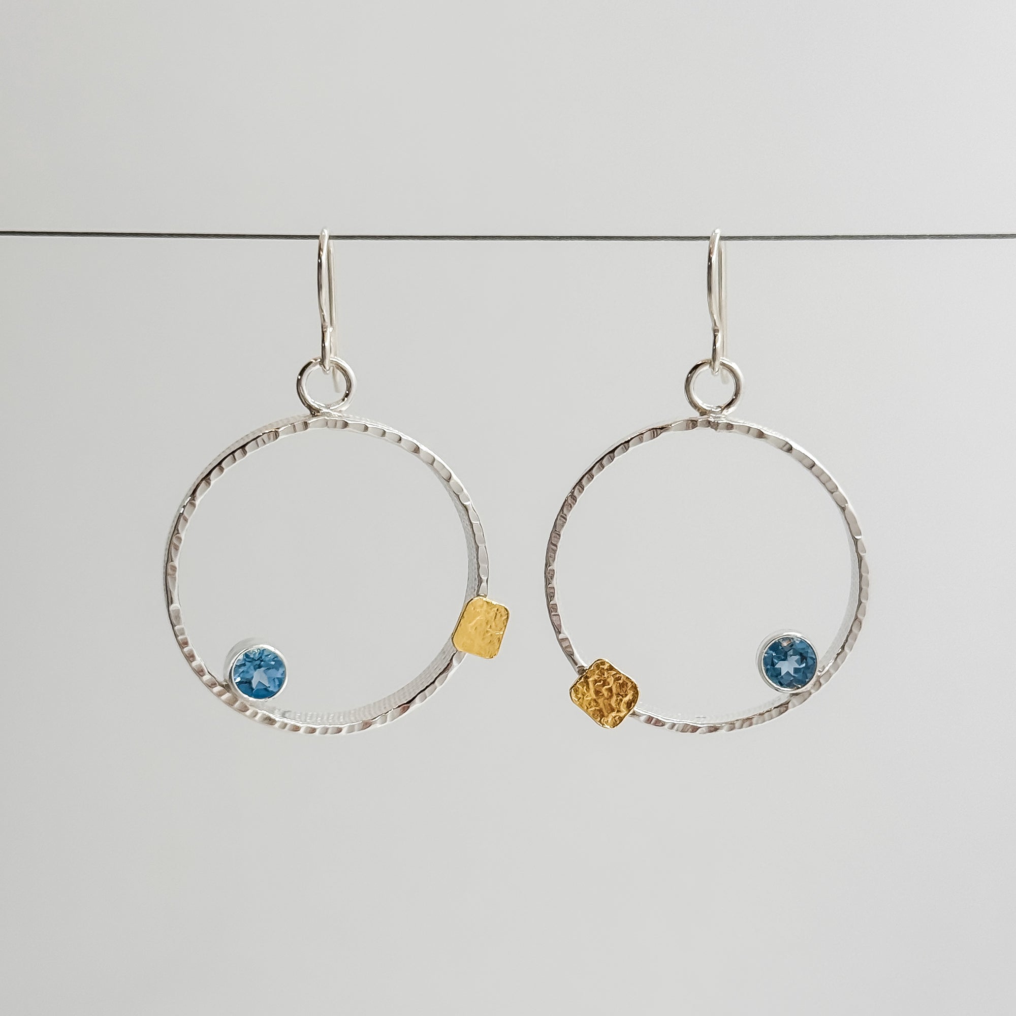 Mars earrings with 5mm faceted Swiss Blue Topaz