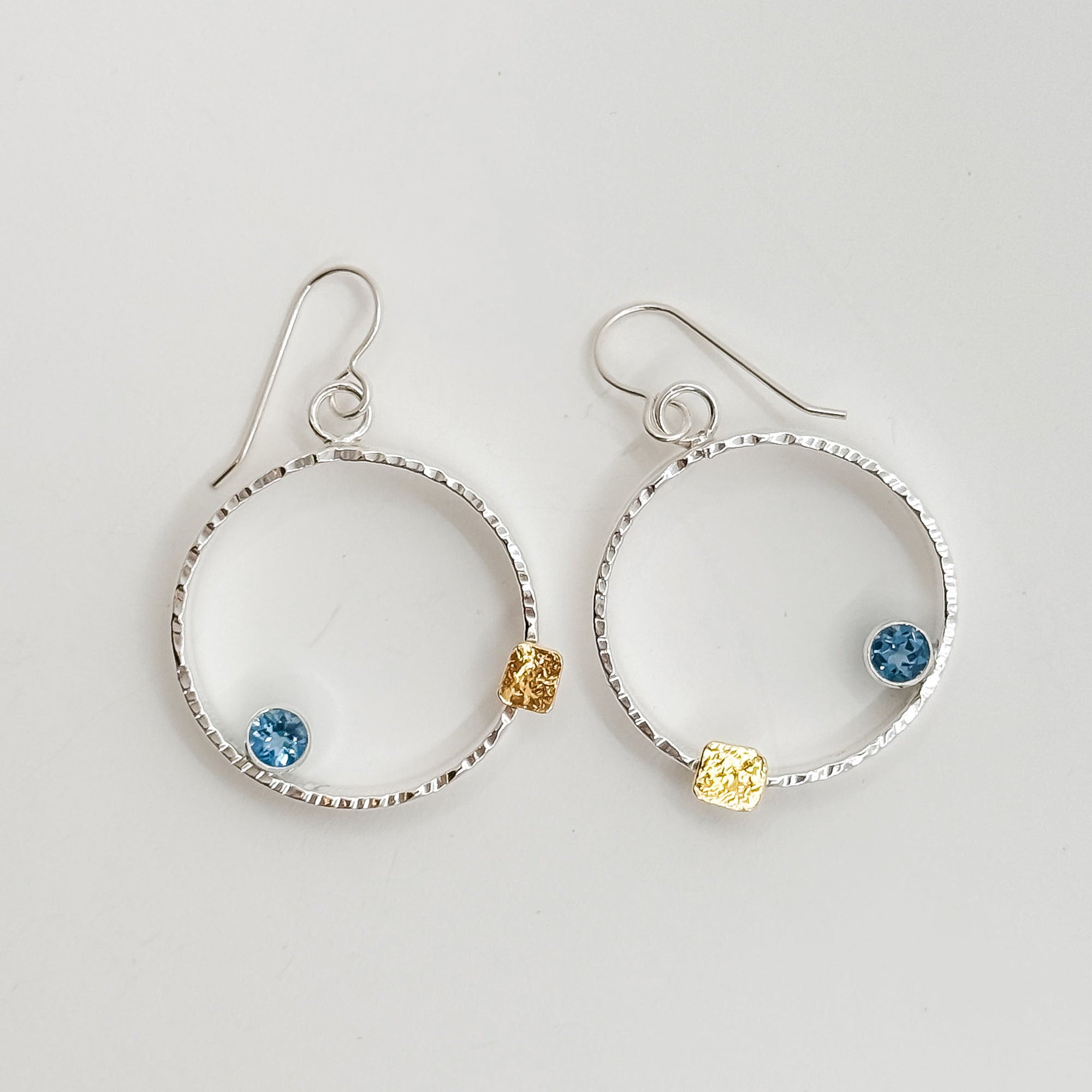 Mars earrings with 5mm faceted Swiss Blue Topaz