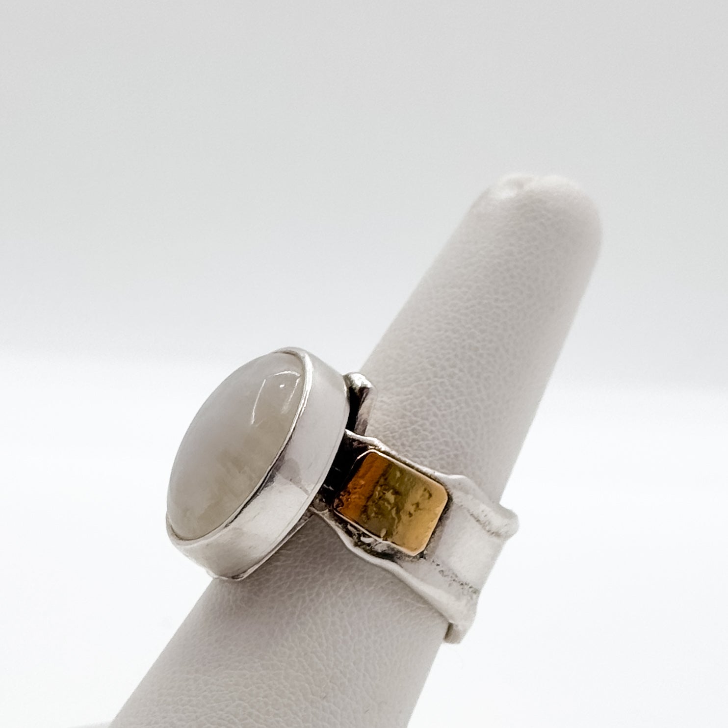 Deckled crotch hugger oval moonstone cabochon ring