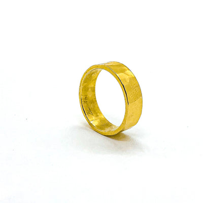 side angle view of 8mm 14k Gold Hammered Band in size 8 by Judie Raiford