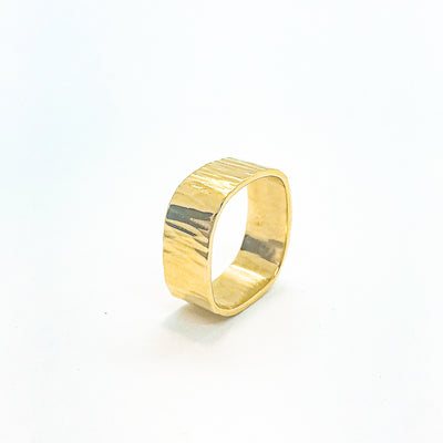 side angle view of 14k Gold Cross Pein Hammered Band by Judie Raiford