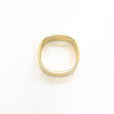 over top view of 14k Gold Cross Pein Hammered Band by Judie Raiford