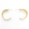 flat lay view of 14k Gold Wedding Ring Hoop Earrings by Judie Raiford