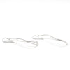 side angle view of sterling silver Textured Pear Drop Earrings by Judie Raiford