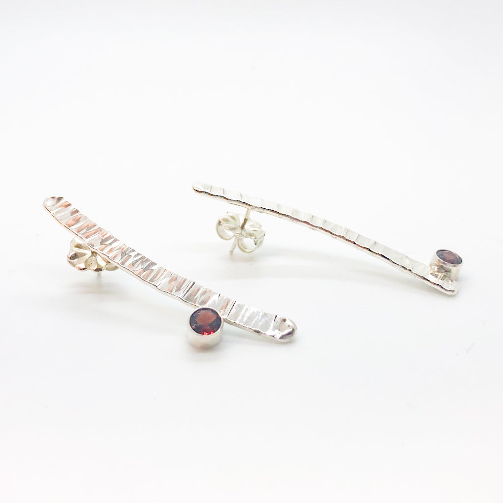 side angle view of Sterling Short Arch Earrings with Garnet by Judie Raiford