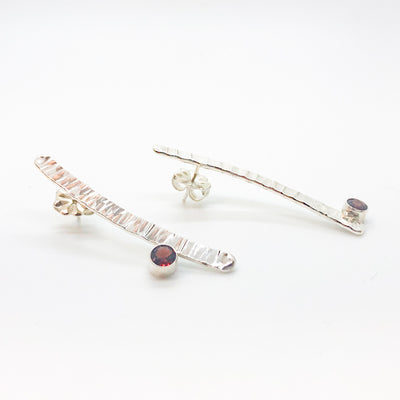 side angle view of Sterling Short Arch Earrings with Garnet by Judie Raiford