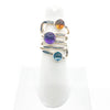 size 6.75 Sterling  Square Wrap Ring with Lemon Citrine, Blue Topaz, and Amethyst by Judie Raiford on white ring display stand