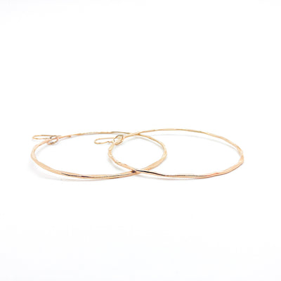 side angle view of 14k Gold Filled Large Hammered Hoop Earrings by Judie Raiford