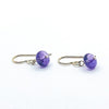 side angle view of Sterling French Hook Amethyst Earrings by Judie Raiford