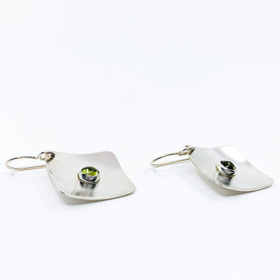 side angle view of Sterling Non Stick Earrings with Peridot by Judie Raiford