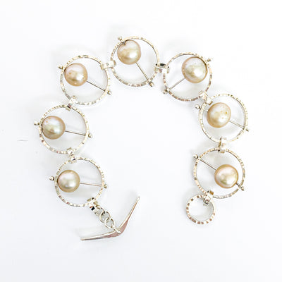 Flat Lay view of Not Naught Round Sterling Bracelet with Champagne Pearls by Judie Raiford
