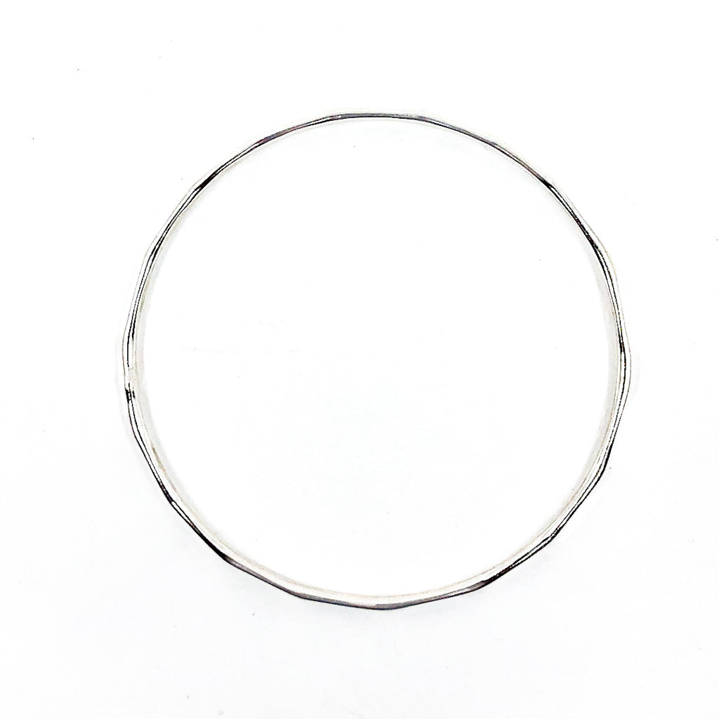 over top view of Sterling Orbit Bangle by Judie Raiford