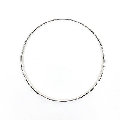 over top view of Sterling Orbit Bangle by Judie Raiford