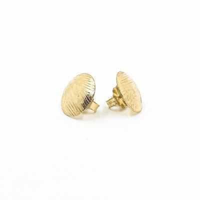 side angle view of 14k Gold Filled Textured Mini Disc Stud Earrings by Judie Raiford