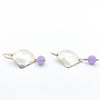 side angle view of Sterling Goat Earrings with Cape Amethyst by Judie Raiford