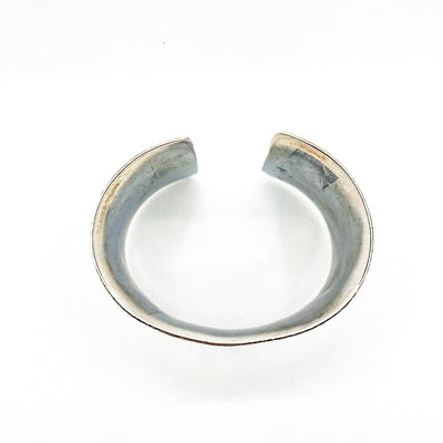 over top view of 1.5" Oxidized Sterling Wide Anticlastic Cuff by Judie Raiford