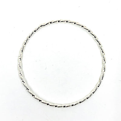 over top view of Sterling Double Twist Bangle by Judie Raiford