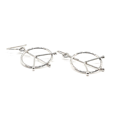 side angle view of sterling silver Small Hammered Peace Sign Earrings by Judie Raiford