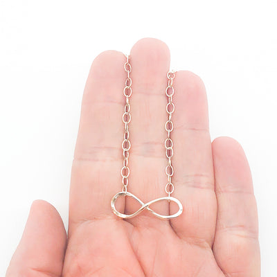 sterling silver Infinity Maggie Necklace by Judie Raiford held in hand