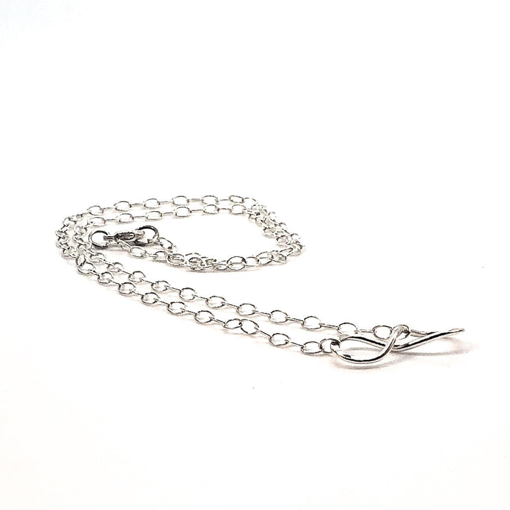 side angle view of sterling silver Infinity Maggie Necklace by Judie Raiford