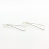 side angle view of Sterling Skinny Hammered Triangle Earrings by Judie Raiford