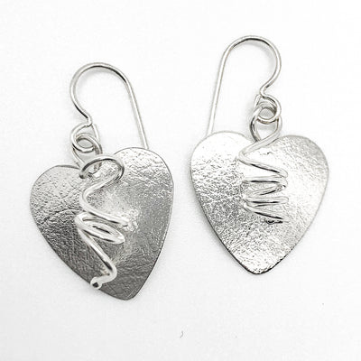 flat lay view of Sterling Silver Curly Heart Earrings by Judie Raiford