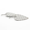 side angle view of Large Sterling Silver Corrugated Heart Earrings by Judie Raiford