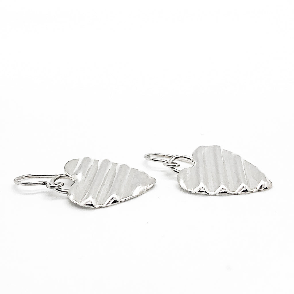 side angle view of Small Sterling Silver Corrugated Heart Earrings by Judie Raiford