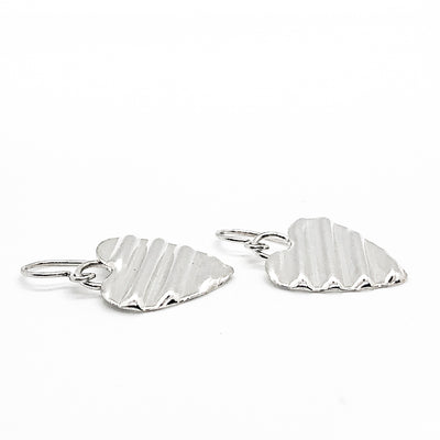 side angle view of Small Sterling Silver Corrugated Heart Earrings by Judie Raiford