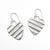 flat lay view of Small Sterling Silver Corrugated Heart Earrings by Judie Raiford